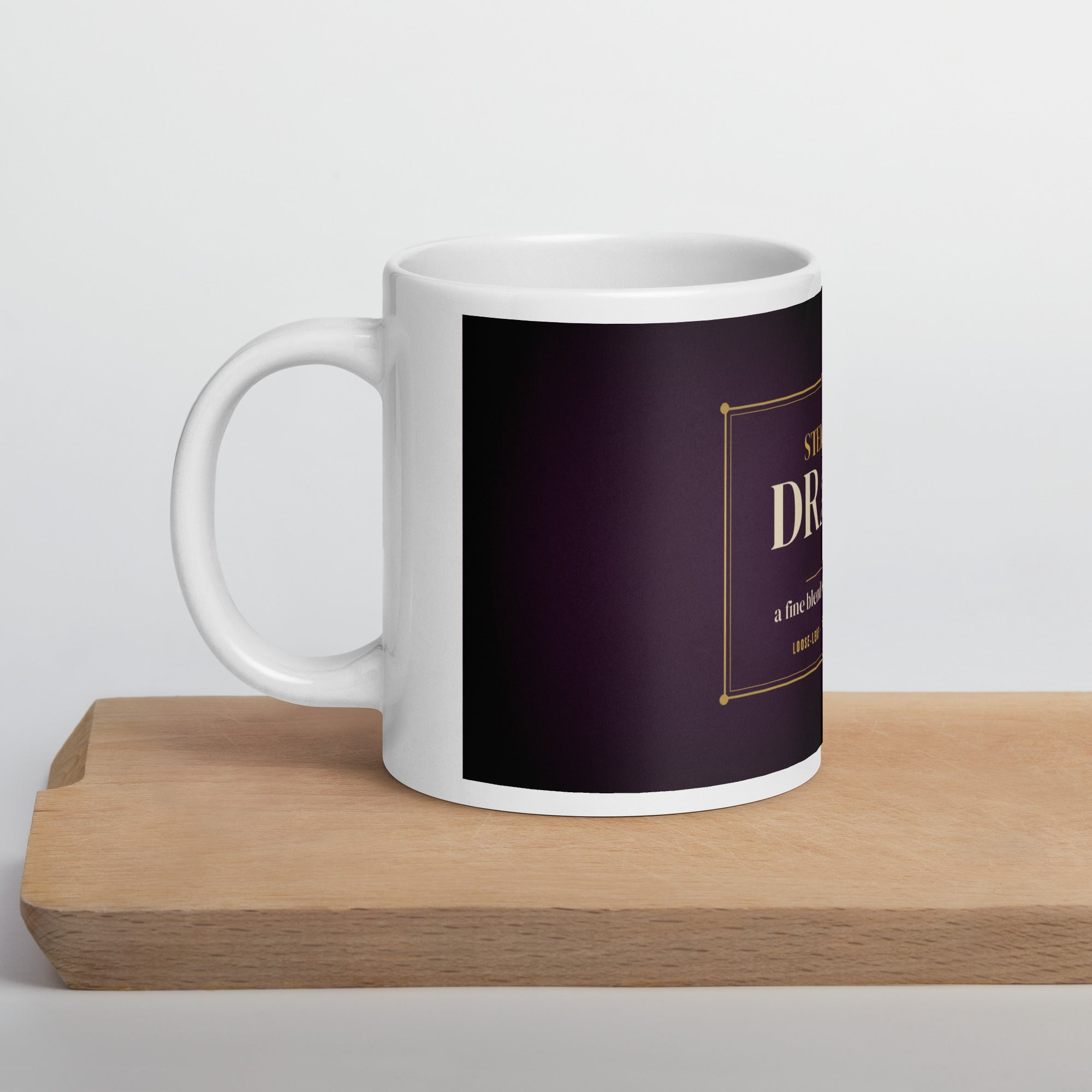 LGBTQ+ pride mug — Steeped in Drama design, 20oz mug on a kitchen cutting board